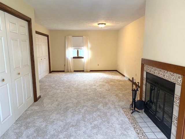 8410 Windsor Beach Ct, Erie, PA 16511 - unfurnished living room featuring a tile fireplace and light colored carpet