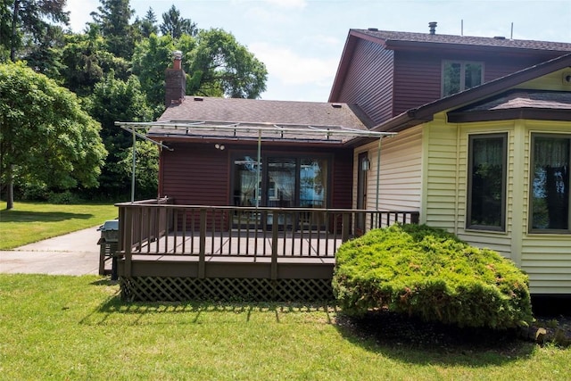 8410 Windsor Beach Ct, Erie, PA 16511 - back of house featuring a lawn, a deck, roof with shingles, and a chimney
