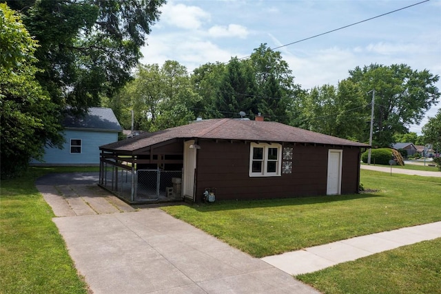 8410 Windsor Beach Ct, Erie, PA 16511 - view of property exterior with a yard, driveway, a chimney, and roof with shingles