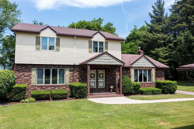 8410 Windsor Beach Ct, Erie, PA 16511 - view of front of home featuring brick siding and a front lawn
