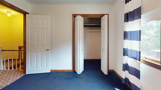 8410 Windsor Beach Ct, Erie, PA 16511 - unfurnished bedroom featuring dark colored carpet and a closet