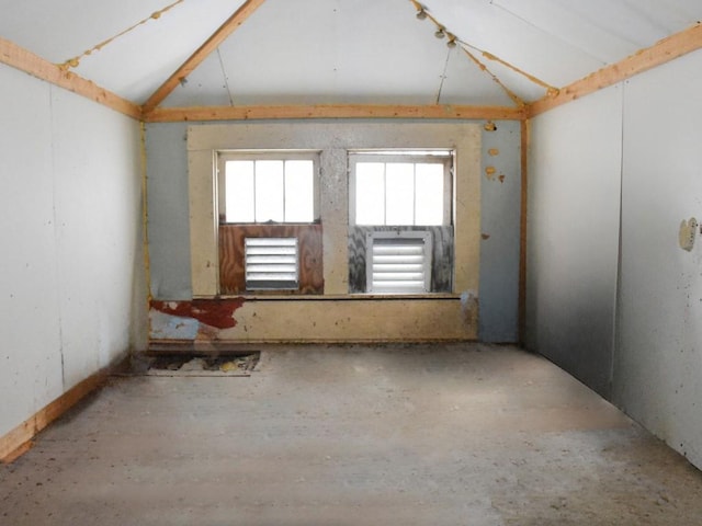 spare room featuring vaulted ceiling