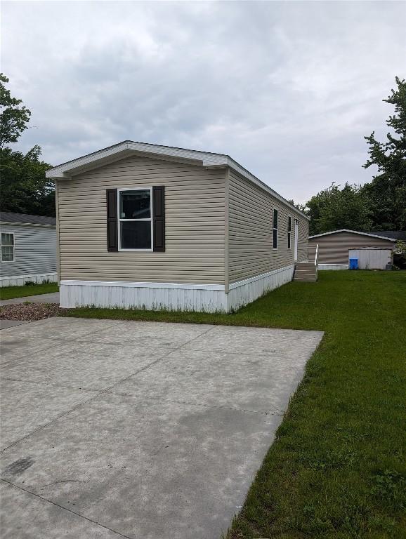 view of home's exterior featuring a yard