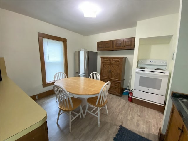 dining space featuring light hardwood / wood-style floors