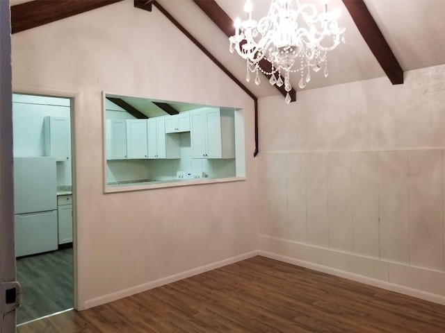 spare room with dark wood-style floors, an inviting chandelier, baseboards, and vaulted ceiling with beams