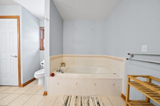 bathroom with toilet, tile patterned flooring, and a relaxing tiled tub