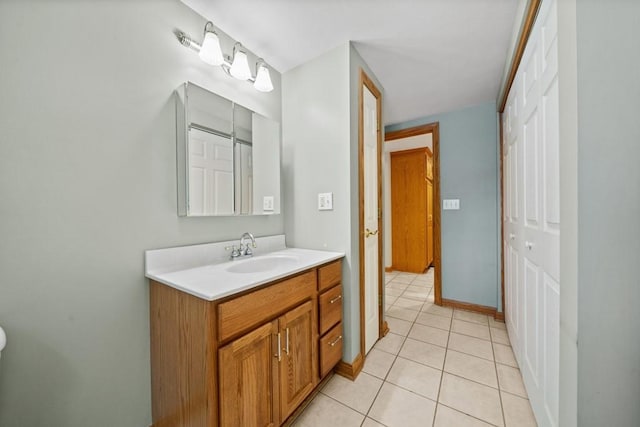 bathroom with tile patterned floors and vanity