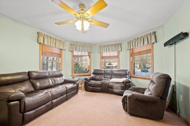 living room featuring carpet and ceiling fan