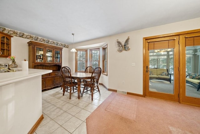 dining room with sink and light tile patterned flooring