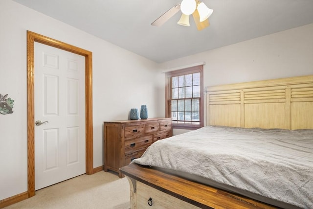 bedroom featuring ceiling fan and light colored carpet