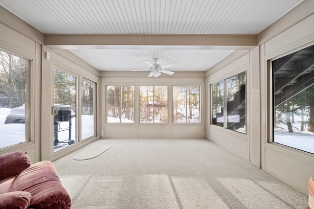 sunroom / solarium featuring ceiling fan