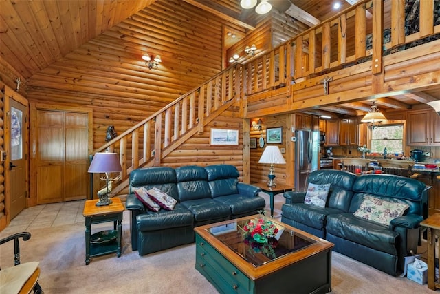 living room with ceiling fan, wooden ceiling, rustic walls, and high vaulted ceiling