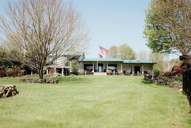 40 Cemetery Rd, Spring Creek, PA 16436 - back of property with covered porch, a lawn, and metal roof