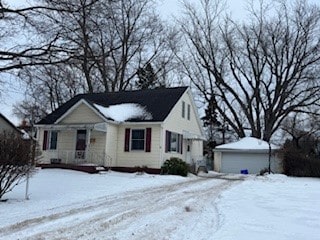 view of front facade with an outbuilding and a garage