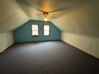 additional living space with lofted ceiling and carpet