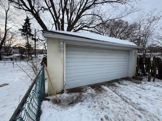 view of snow covered garage