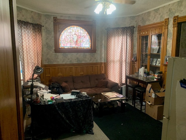 760-762 Park Ave, Meadville, PA 16335 - carpeted living area with wainscoting, a ceiling fan, wallpapered walls, and ornamental molding
