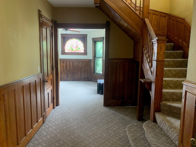 760-762 Park Ave, Meadville, PA 16335 - stairs with carpet floors, wainscoting, radiator heating unit, and a ceiling fan