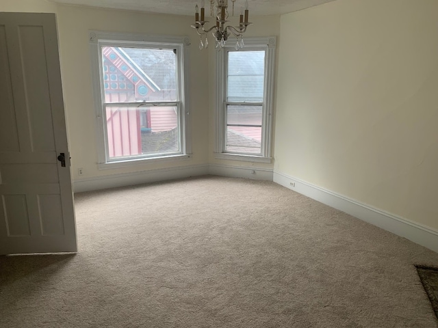 760-762 Park Ave, Meadville, PA 16335 - empty room with carpet flooring and a chandelier