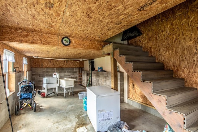 interior space featuring refrigerator and sink