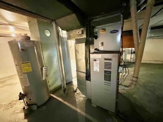 utility room with heating unit and water heater