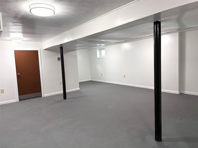 below grade area featuring baseboards