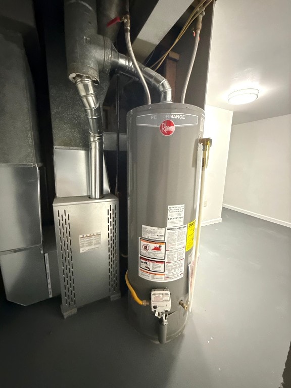 utility room featuring gas water heater