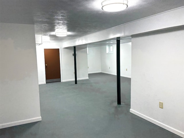 finished basement featuring baseboards
