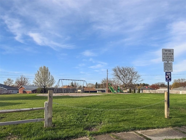 view of community with fence and playground community