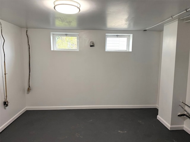below grade area featuring baseboards and a wealth of natural light