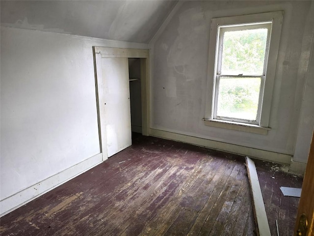 1051-1053 W 9th St, Erie, PA 16502 - unfurnished bedroom with hardwood / wood-style flooring, vaulted ceiling, and multiple windows
