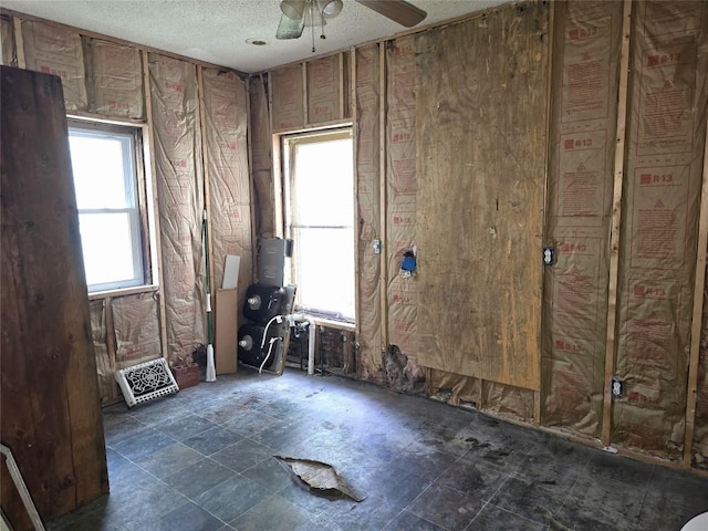 1051-1053 W 9th St, Erie, PA 16502 - empty room featuring a textured ceiling and a ceiling fan