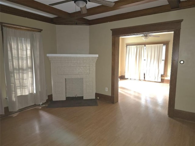 1051-1053 W 9th St, Erie, PA 16502 - unfurnished living room with a ceiling fan, beamed ceiling, wood finished floors, healthy amount of natural light, and a brick fireplace