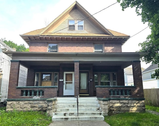 1051-1053 W 9th St, Erie, PA 16502 - american foursquare style home with a porch and brick siding