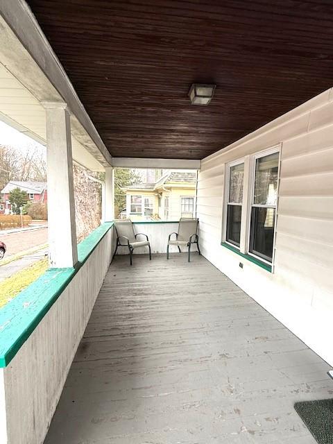 unfurnished sunroom featuring wooden ceiling