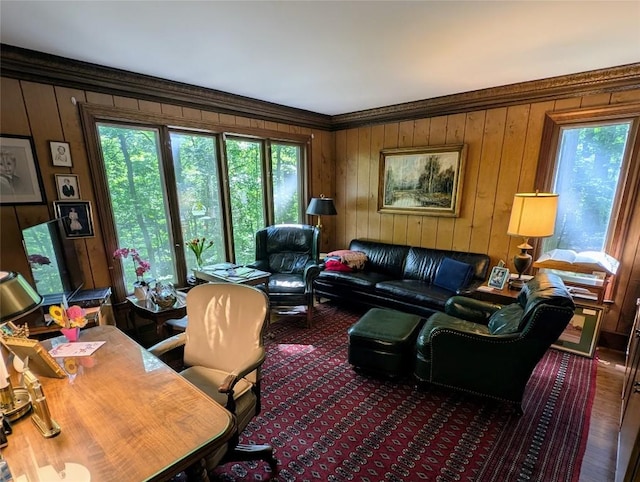 5441 Thomas Rd, Fairview, PA 16415 - living room featuring ornamental molding, wood walls, and wood finished floors