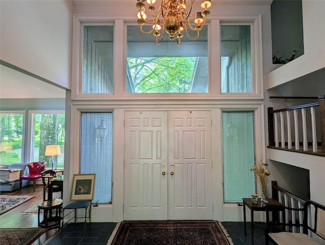 5441 Thomas Rd, Fairview, PA 16415 - entryway with a towering ceiling, a chandelier, and wood finished floors