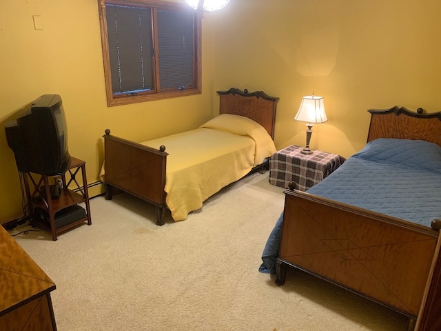 bedroom featuring carpet flooring and baseboard heating