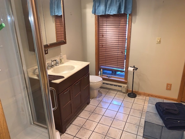 bathroom with vanity, tile patterned flooring, toilet, baseboard heating, and an enclosed shower