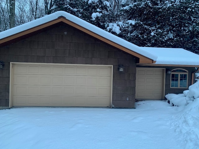 view of snow covered garage