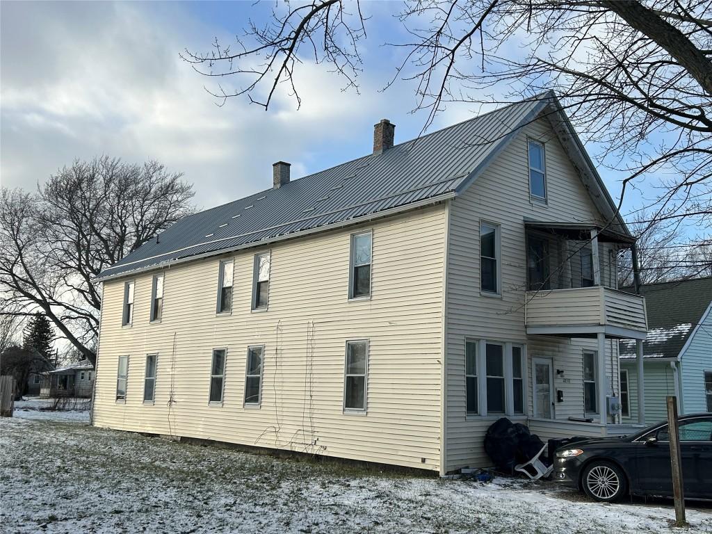 view of snow covered house