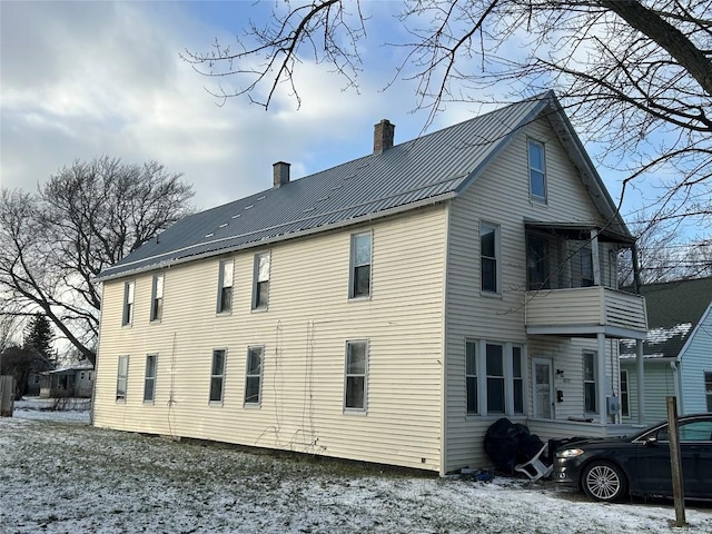 view of snow covered house