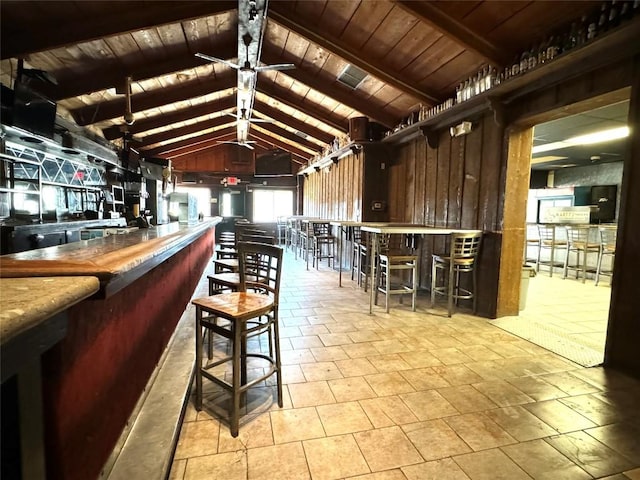 bar with vaulted ceiling with beams and wooden ceiling