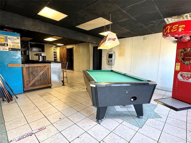 game room featuring bar, a drop ceiling, and billiards