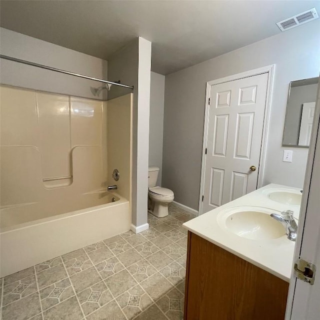 2517 Mccain Ave, Erie, PA 16510 - full bathroom with double vanity, toilet, shower / bathtub combination, baseboards, and tile patterned flooring
