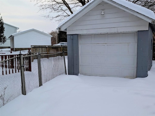 view of snow covered garage