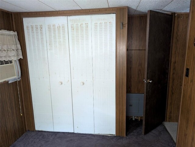 12838 Reed Ave, Conneaut Lake, PA 16316 - unfurnished bedroom with a closet, carpet flooring, and wood walls