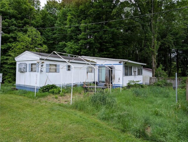 12838 Reed Ave, Conneaut Lake, PA 16316 - view of green lawn featuring a wooded view