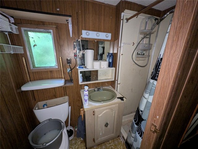 12838 Reed Ave, Conneaut Lake, PA 16316 - full bathroom with toilet, curtained shower, vanity, and wood walls