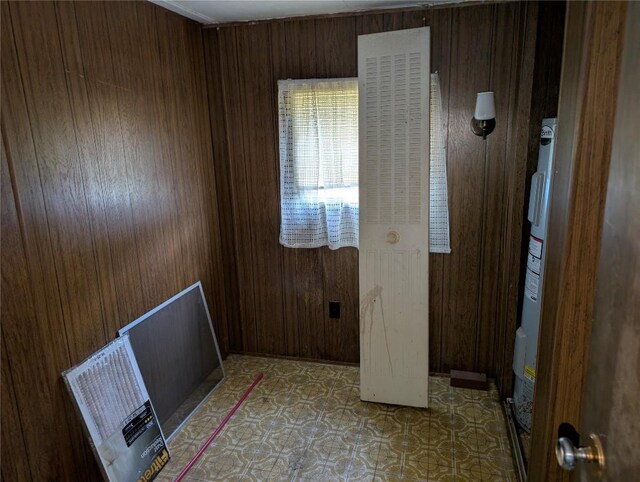 12838 Reed Ave, Conneaut Lake, PA 16316 - empty room with wood walls and light floors